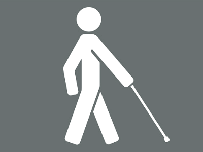 A graphic showing a person holding a long cane. 